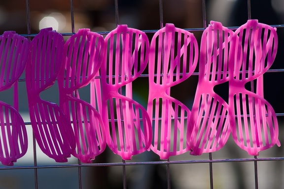 Pink sunglasses on a stand